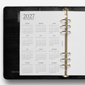 Black planner with a calendar page for 2027 on a white background